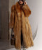 A woman wears a luxurious red fox fur coat styled sporty and chic, its soft, dense fur and sleek 130cm length offering warmth and elegance during cold winter days.