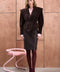 A woman is seen wearing a dark brown suede leather jacket, combining ultra-stylish design with refined details and a flattering tailored fit.